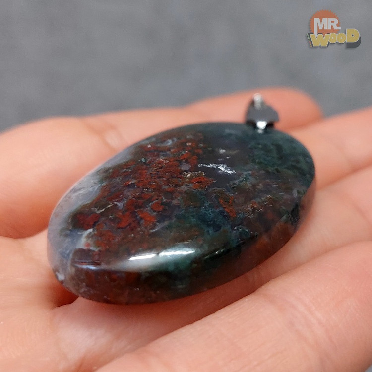 Authentic Persian moss agate gemstone in dark teal and crimson red tones